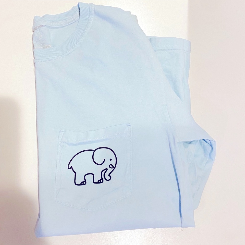 Ivory ella light blue shirt. Pocket logo on front, big colorful logo on back.